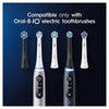 Five electric toothbrush heads and two matching handles are shown against a dark blue gradient background with white text reading 'Compatible only with Oral-B iO electric toothbrushes.'.